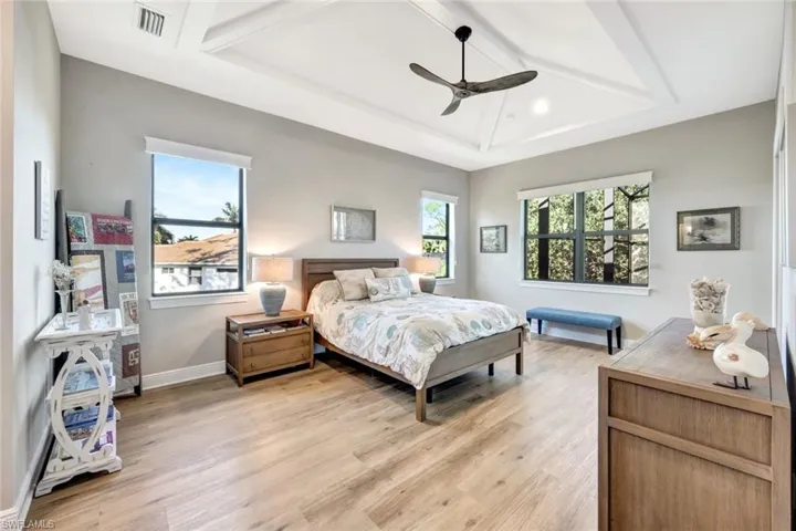 Master Bedroom featuring ceiling fan, vaulted ceiling