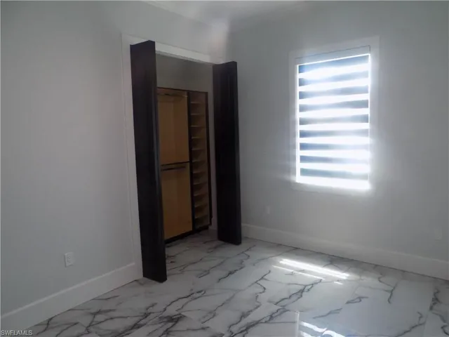 Empty room with light marble finish floors