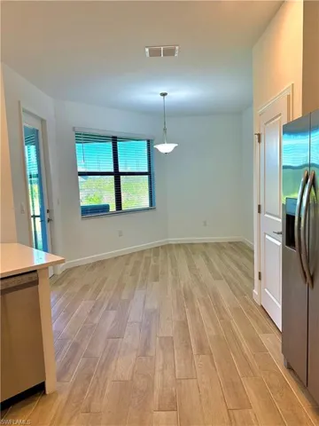 Unfurnished dining area featuring light wood finished floors