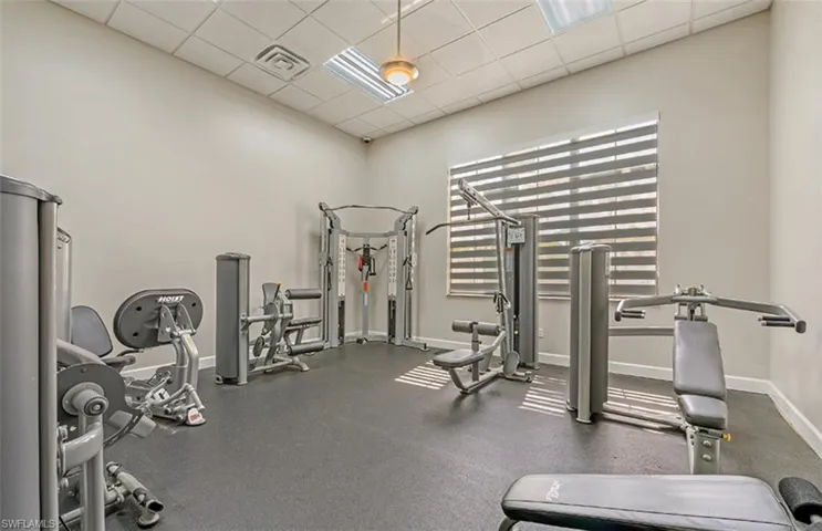 Gym featuring a paneled ceiling