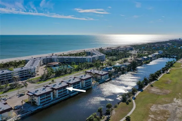Bird's eye view of apartment complex / building and a nearby body of water