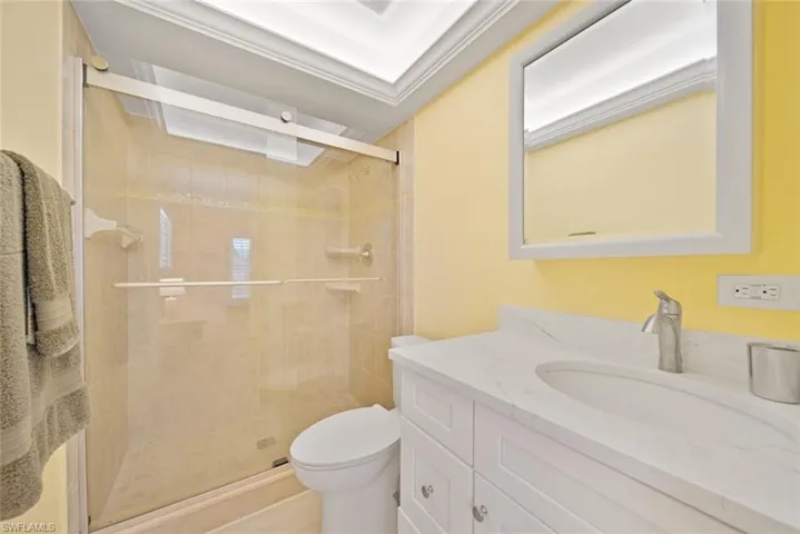 Full bath with vanity and a stall shower