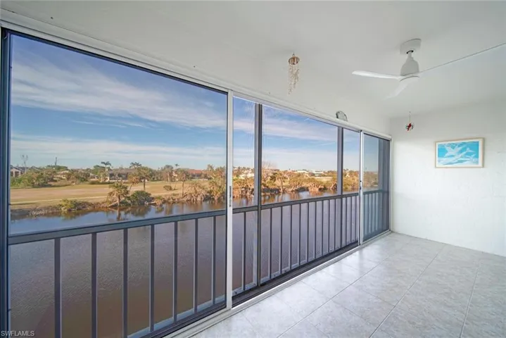 Unfurnished sunroom featuring a water view