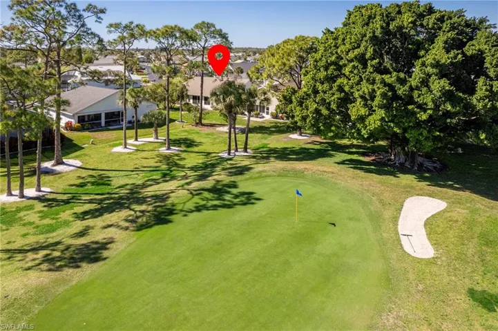 View of community featuring view of golf course and a putting area