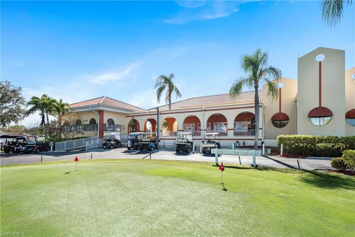 View of front clubhouse with putting green.
