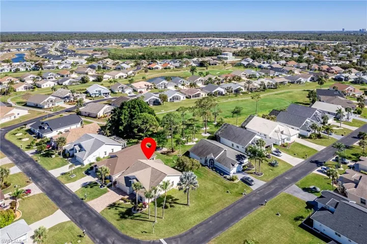 View of property location with nearby suburban area
