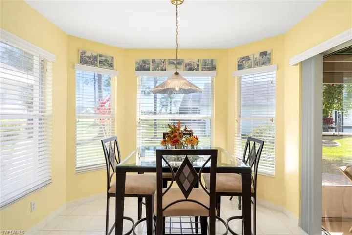 Dining room with light tile patterned floors