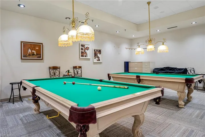 Playroom with carpet floors and billiards table