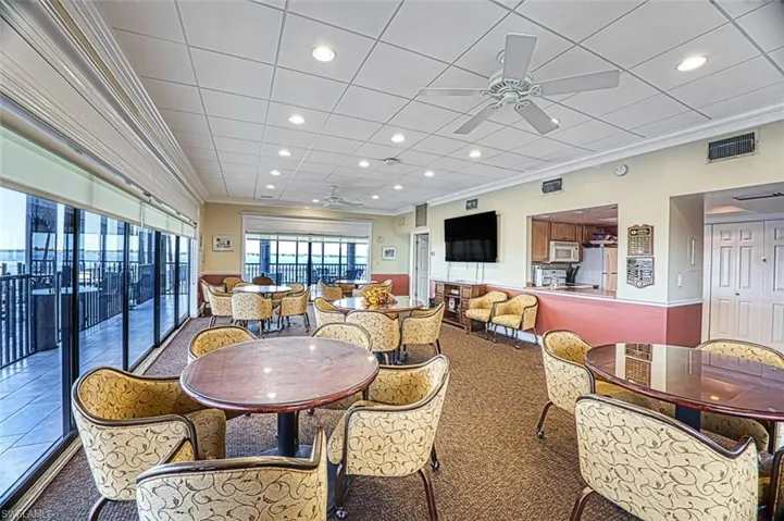 Community room with river views, pass through kitchen, tv - great for game night or parties.