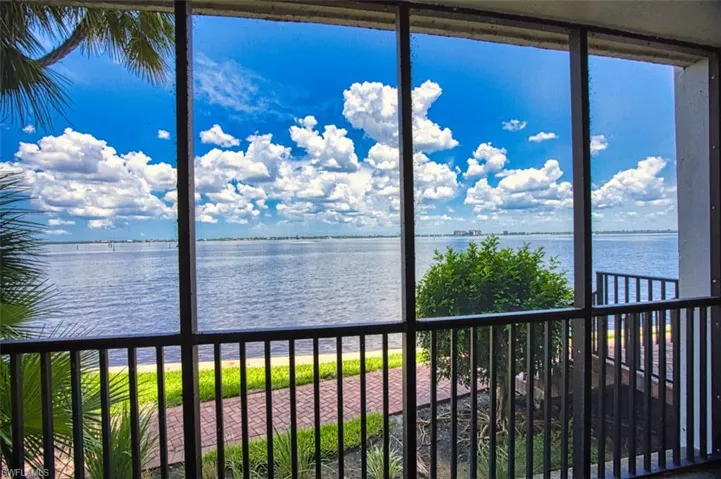 Large lanai with door to the riverfront walkway.  Enjoy your evening beverage overlooking the river view with gorgeous sunsets.