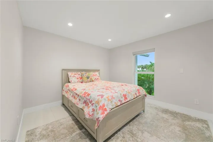 Bedroom with recessed lighting and baseboards