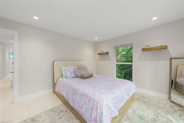 Bedroom featuring recessed lighting and tile patterned floors