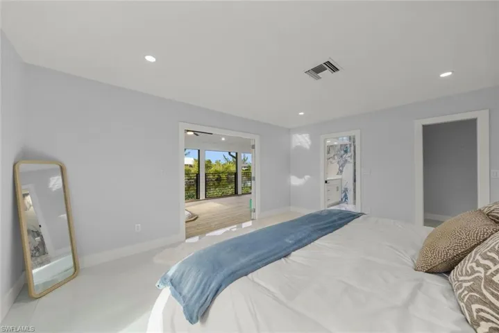 Bedroom with recessed lighting and connected bathroom