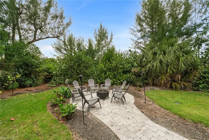 View of patio with a fire pit