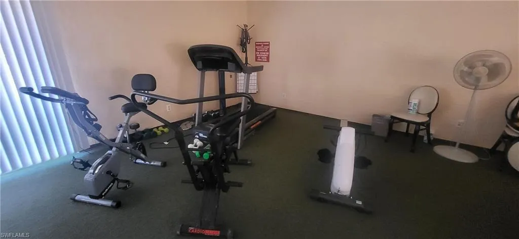 View of exercise room in clubhouse with a kitchen to use for parties
