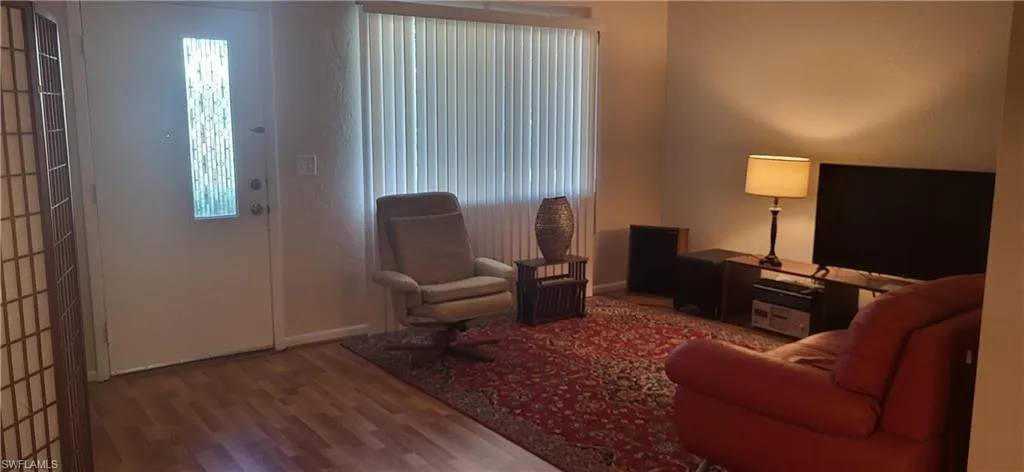 Living room with plenty of natural light and light wood-type flooring