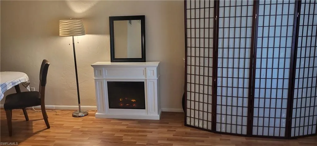Living room with hardwood / wood-style floors