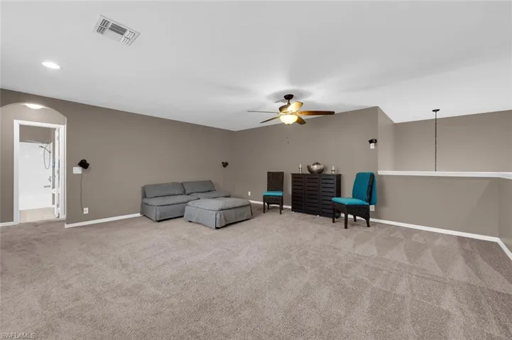 Sitting room with carpet floors and ceiling fan
