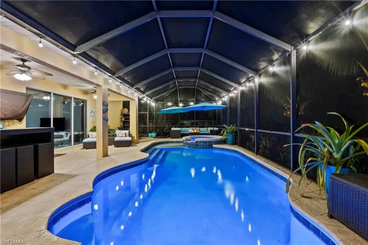 View of pool featuring an outdoor living space, an in ground hot tub, ceiling fan, and a patio area
