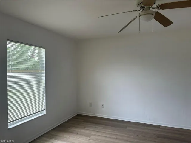 Spare room featuring light wood-style floors and a ceiling fan