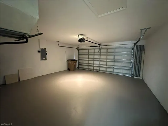 Garage featuring electric panel