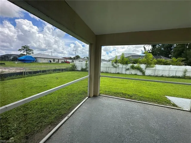 Unfurnished sunroom with a residential view