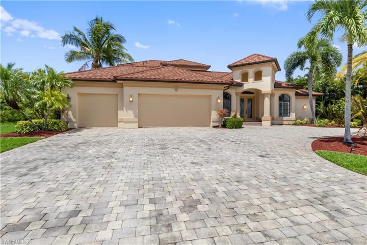 Mediterranean / spanish house featuring a garage