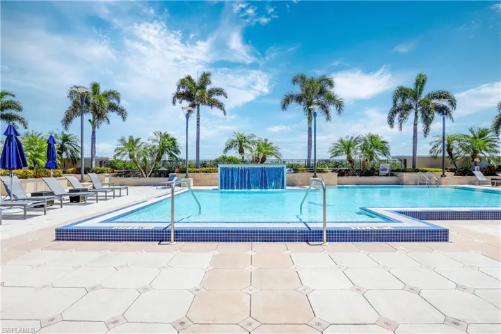View of swimming pool featuring a patio and pool water feature