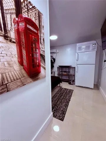 Hall featuring baseboards