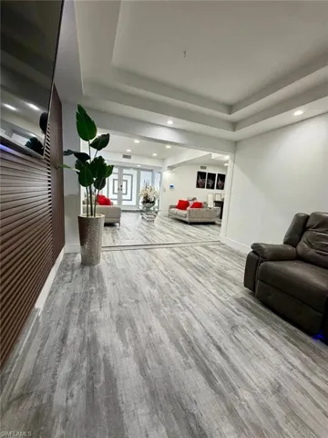 Lobby with recessed lighting and a raised ceiling