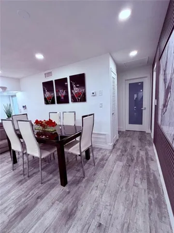 Dining area featuring light wood-type flooring and recessed lighting