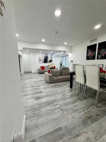 Living room featuring light wood-style floors and recessed lighting