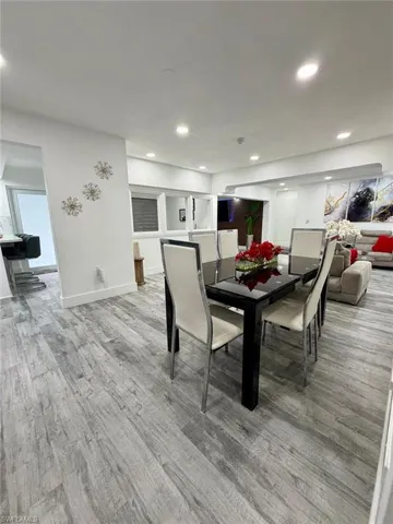 Dining space featuring light wood-style flooring and recessed lighting