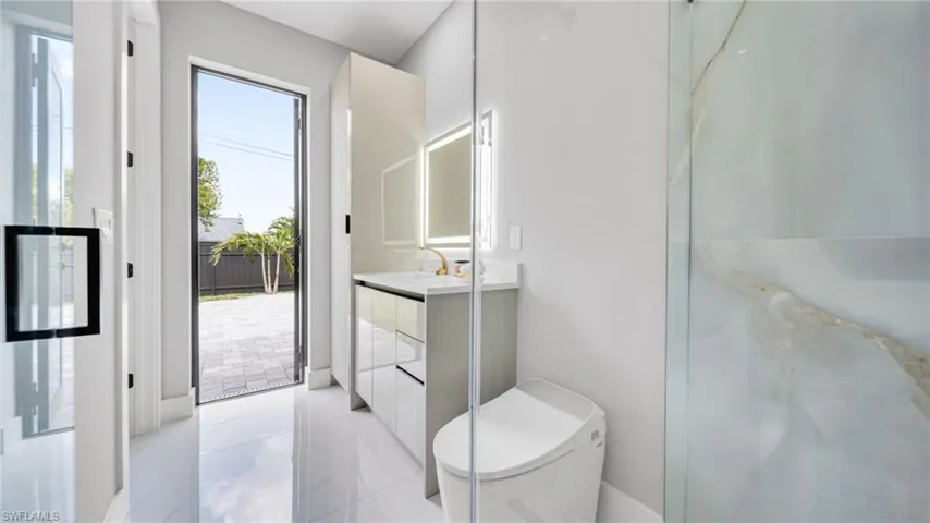 Full bathroom featuring vanity and light tile patterned floors