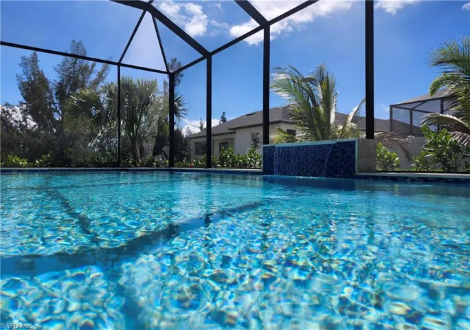 Outdoor pool featuring glass enclosure