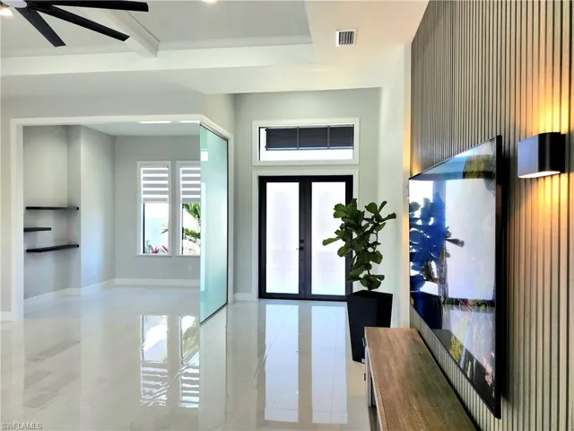 Foyer featuring french doors, visible vents, and baseboards