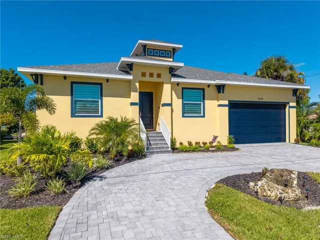 Contemporary stucco exterior with a prominent cupola
