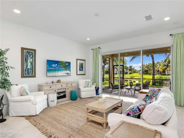 Living room featuring light tile flooring