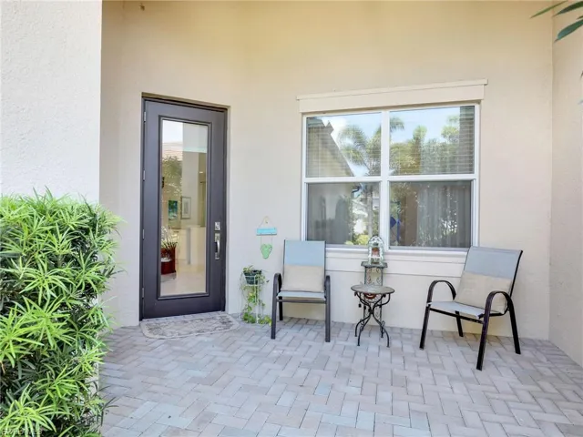 Doorway to property featuring a patio