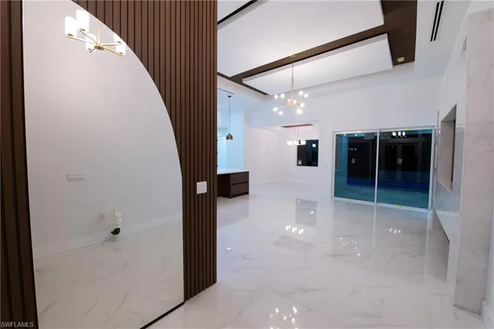 Hall with a notable chandelier
