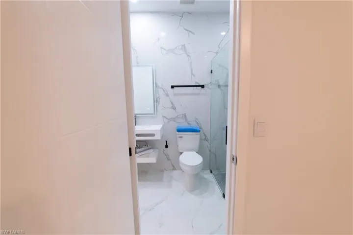 Bathroom featuring toilet and a shower