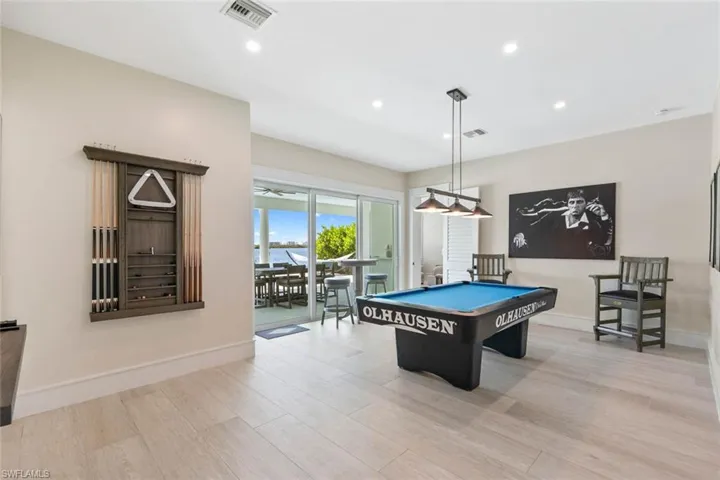 Recreation room with light wood-style floors, recessed lighting, and pool table