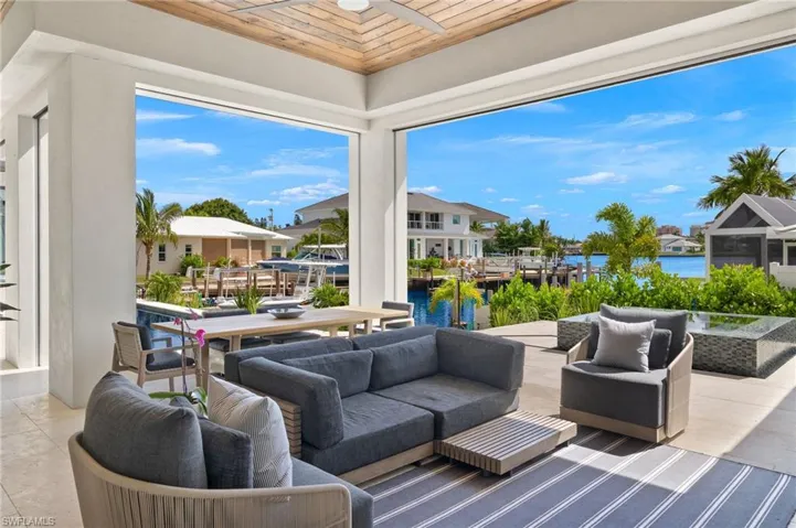 View of patio / terrace featuring outdoor lounge area, a water view, and a residential view