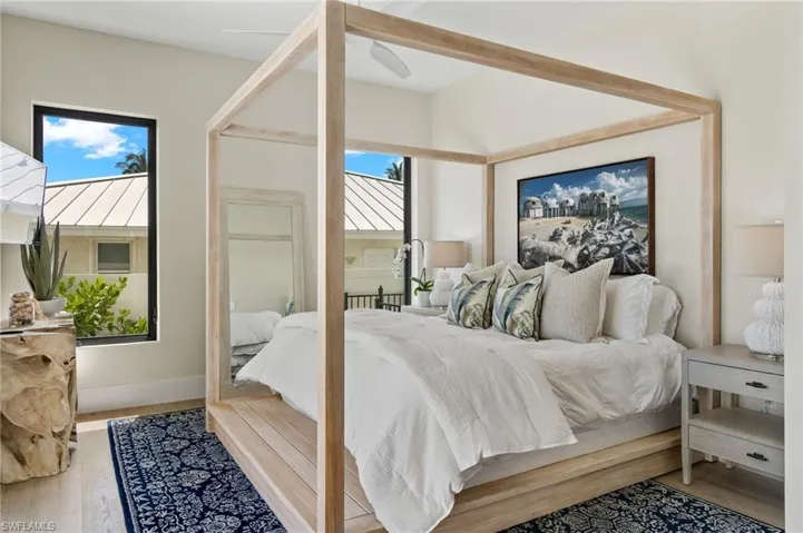 Bedroom featuring wood finished floors and baseboards