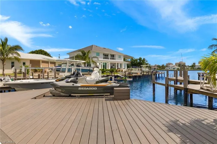 Dock area with a water view and boat lift
