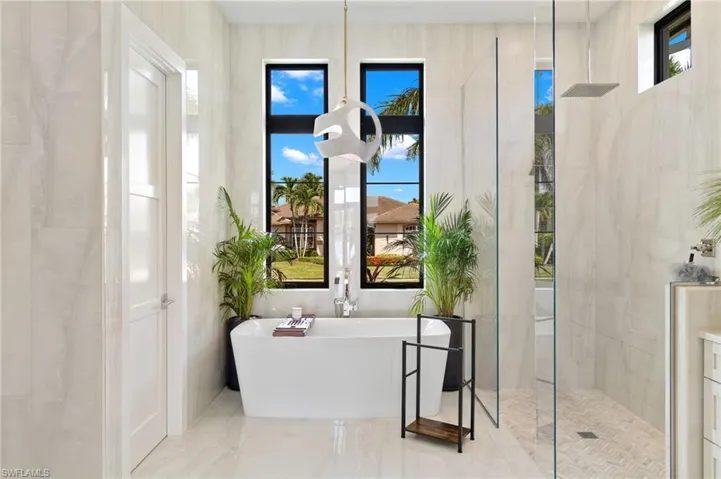 Full bath with a soaking tub and walk in shower