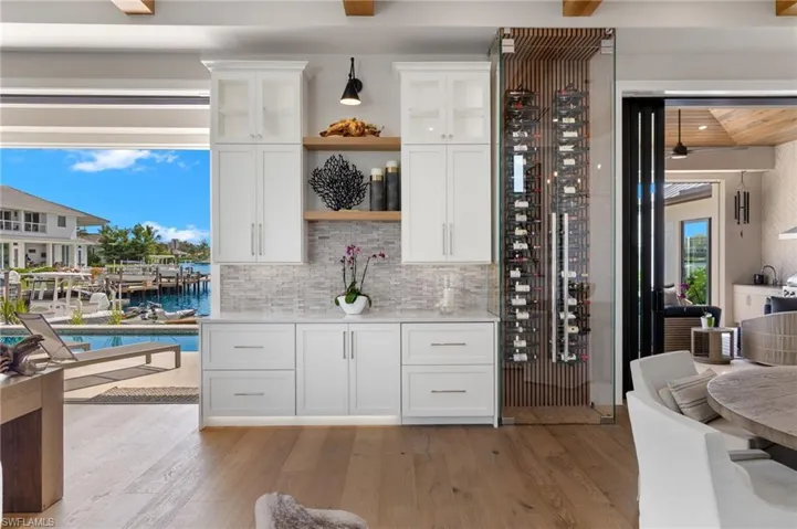 Wine area featuring light wood finished floors