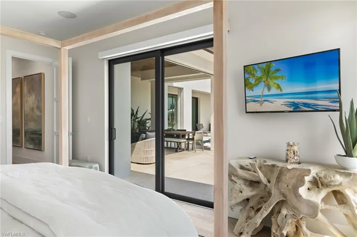 Bedroom featuring wood finished floors and french doors