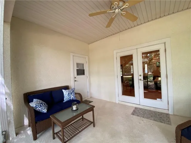 View of patio with french doors, a ceiling fan, and an outdoor living space