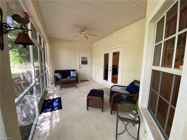 Sunroom / solarium with french doors, a ceiling fan, and outdoor lounge area
